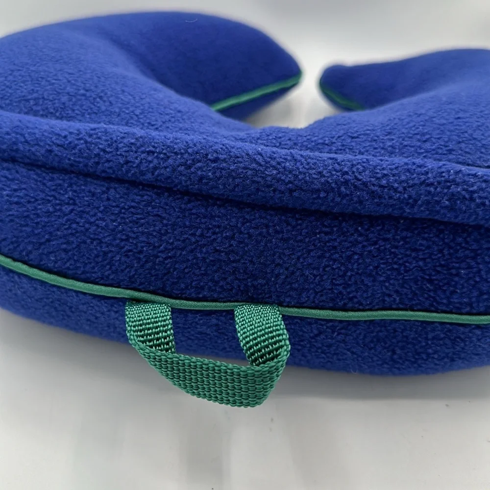 Austin House blue neck travel pillow with green piping